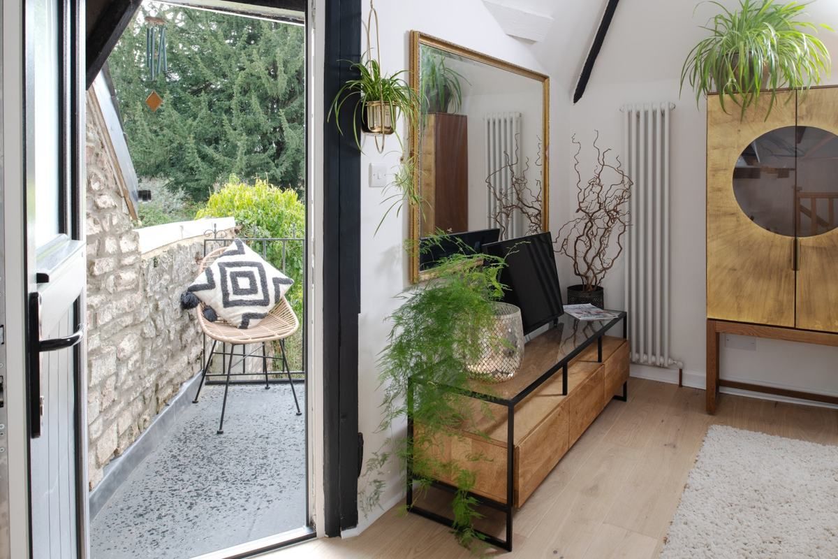 Rattan chair on the bedroom balcony, Fairy Cottage at Lea Hall