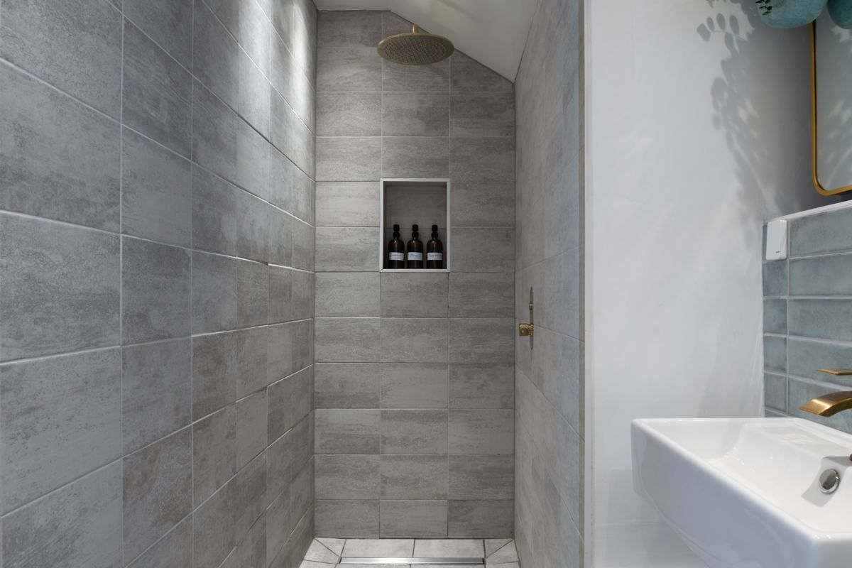 Walk-in shower with a brass rainfall head, Fairy Cottage at Lea Hall